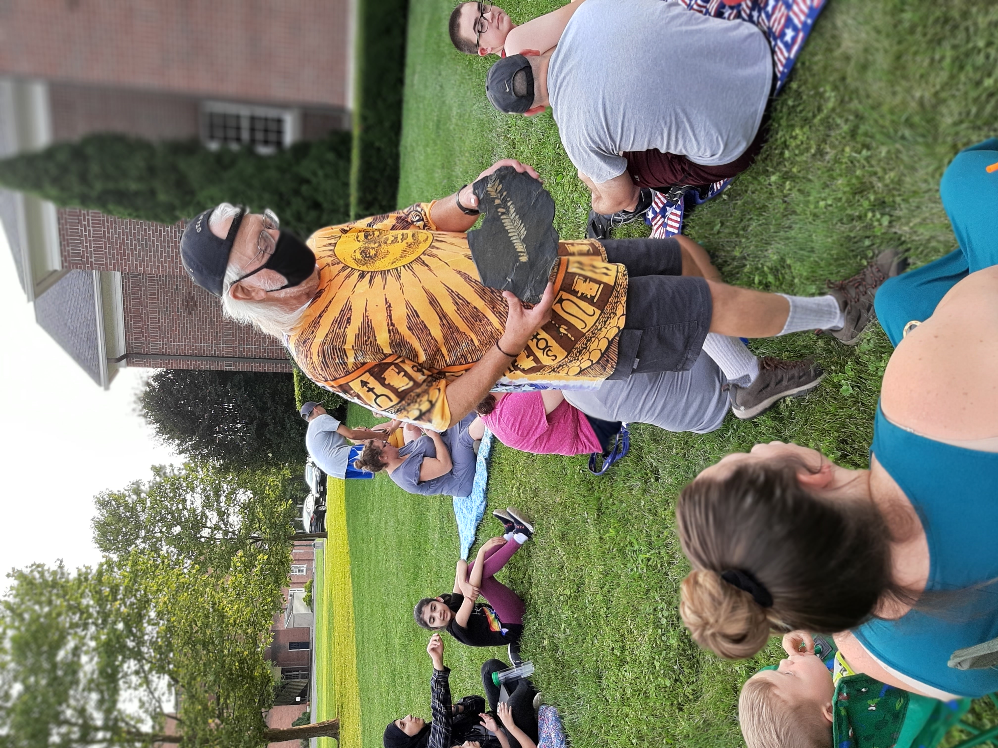 Showing off a fern fossil at the Seneca Falls Public Library in 2021.