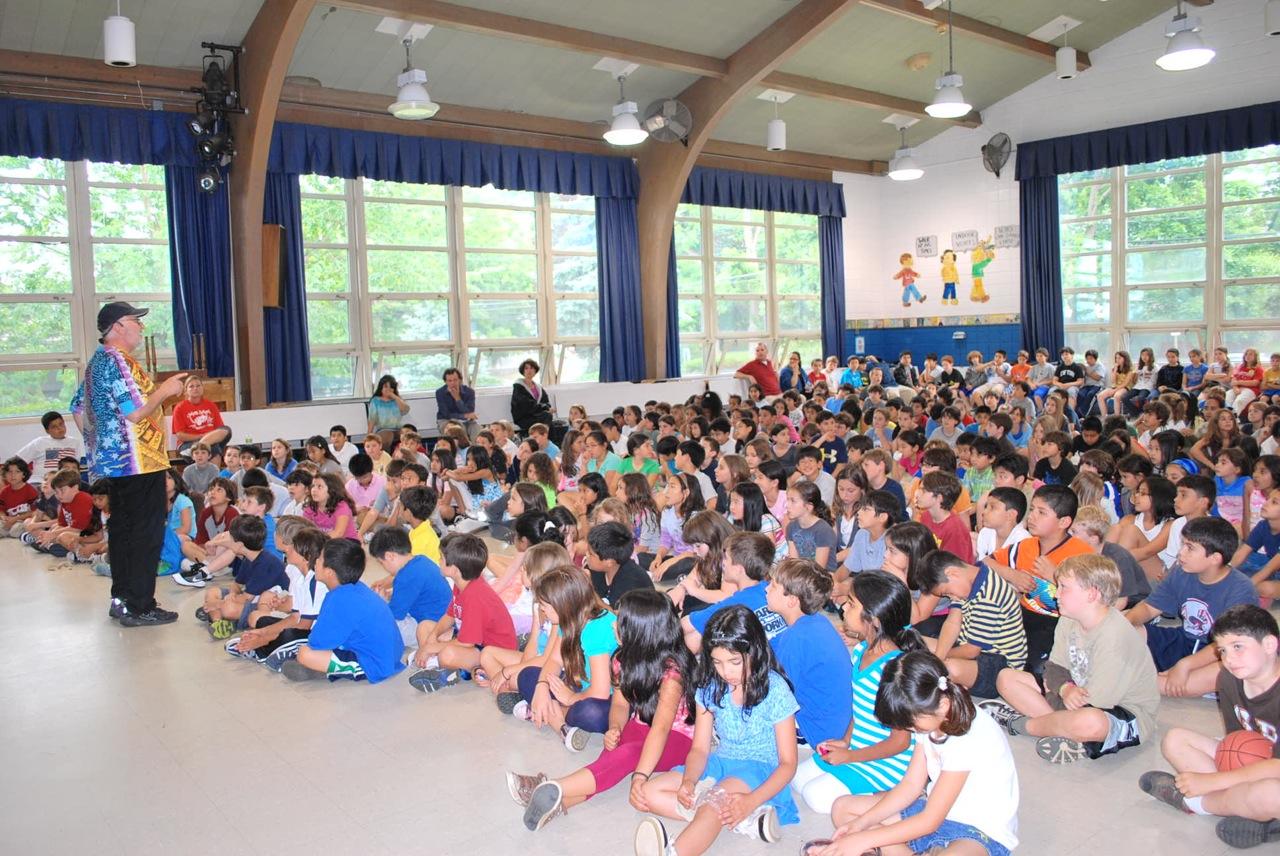 Talking with friends at Manorhaven School. Photo by Vivian Moy.